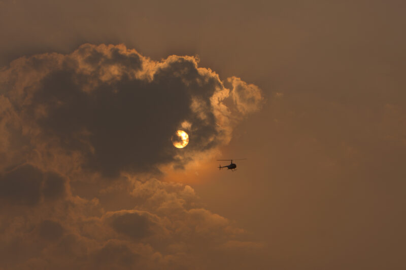 Clouds — Stock Images of people living in a floating village on Tonle Sap Lake, Cambodia — Cambodia, clouds, sun, helecopter
