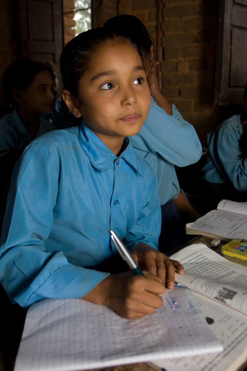 Girl in School in Nepal — Children attend school in rural Nepal, thanks to a sponsorship program run by ADRA — Nepal, students, children, elementary, school