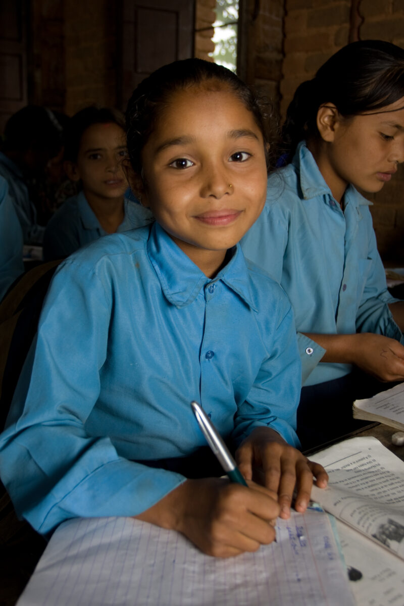 Girl in School in Nepal — Children attend school in rural Nepal, thanks to a sponsorship program run by ADRA — Nepal, students, children, elementary, school