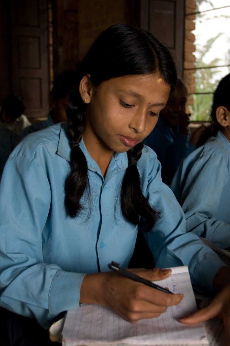 Girl in School in Nepal — Children attend school in rural Nepal, thanks to a sponsorship program run by ADRA — Nepal, students, children, elementary, school