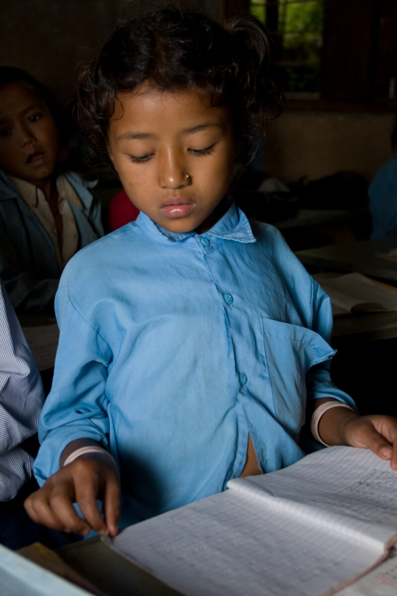 Girl in School in Nepal — Children attend school in rural Nepal, thanks to a sponsorship program run by ADRA — Nepal, students, children, elementary, school