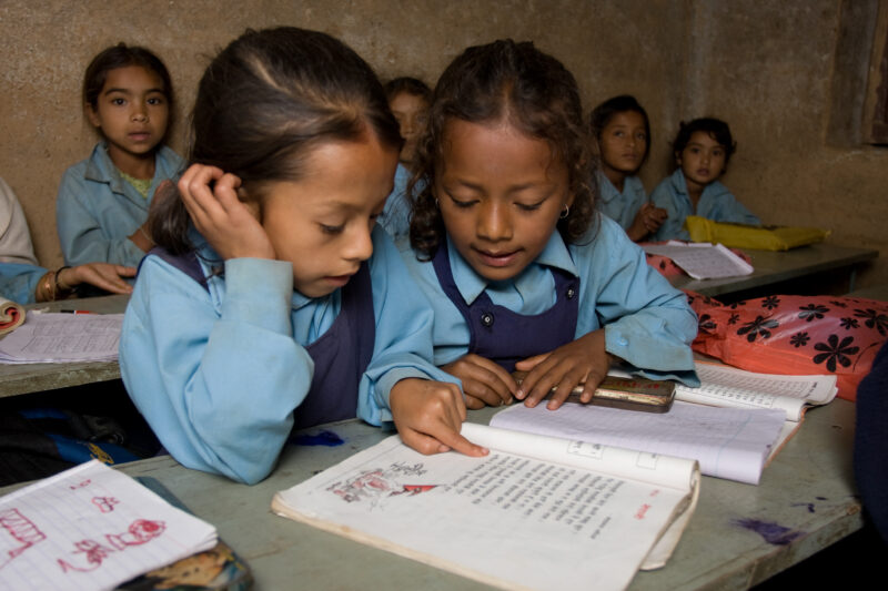 Girls in School in Nepal — Children attend school in rural Nepal, thanks to a sponsorship program run by ADRA — Nepal, students, children, elementary, school