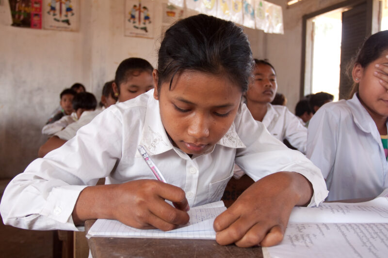 Girl in School in Cambodia — Students in a rural school in Cambodia, thanks to the Reflect group run by ADRA, that taught their parents the importance of a g...