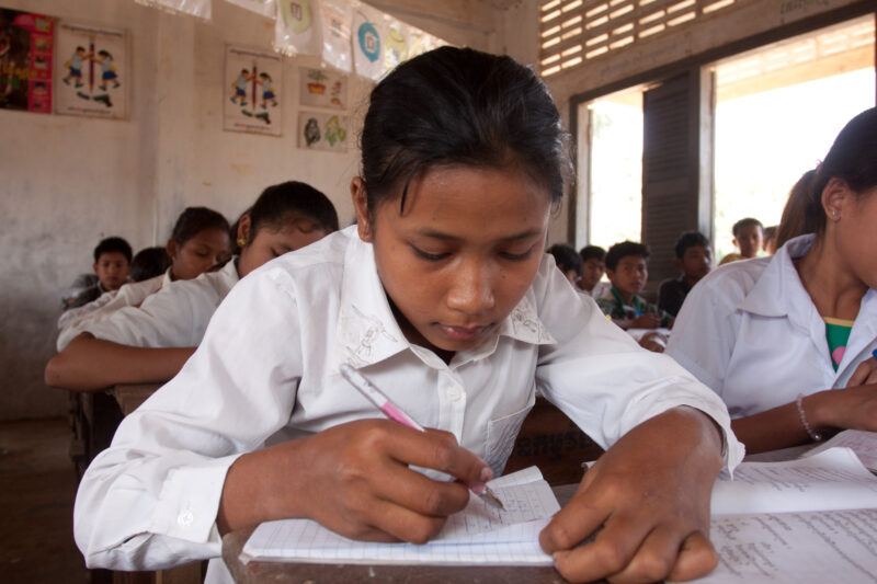 Girl in School in Cambodia — Students in a rural school in Cambodia, thanks to the Reflect group run by ADRA, that taught their parents the importance of a g...