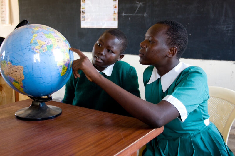 Girls with Globe at School — Students in the Nyburi center for disabled children learn geography at their school. — ADRA, AID, Africa, Assistance, Development