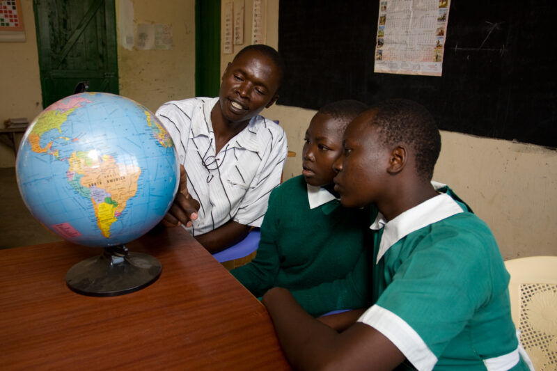 Teacher with Students and Globe — Students in the Nyburi center for disabled children learn geography at their school. — ADRA, AID, Africa, Assistance, Devel...