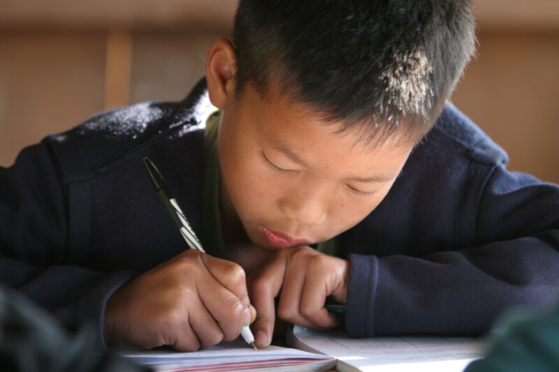 Student in a Rural School in Laos — Young children attend a school in their village, in a remote jungle region of northern Laos — Laos, Children, school, cla...