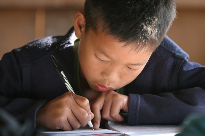 Student in a Rural School in Laos — Young children attend a school in their village, in a remote jungle region of northern Laos — Laos, Children, school, cla...