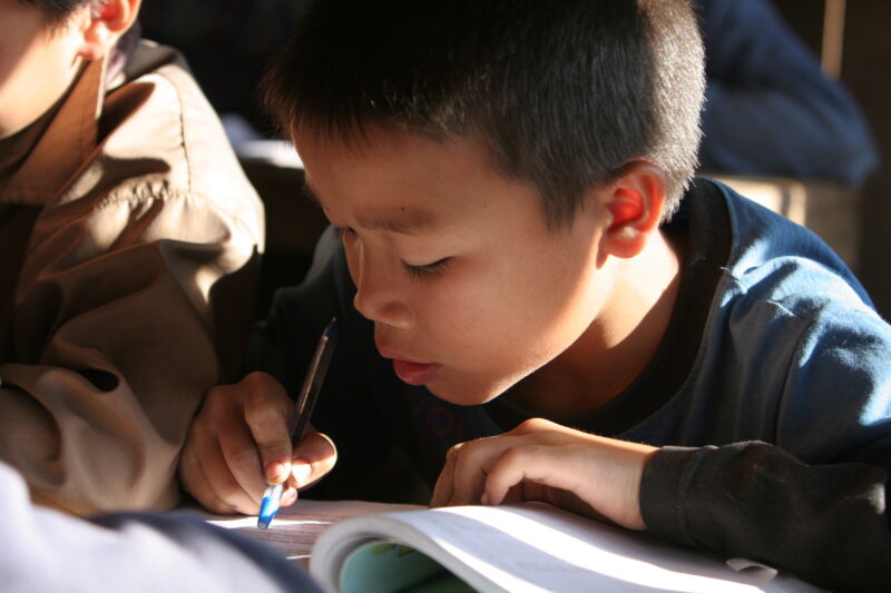 Student in a Rural School in Laos — Young children attend a school in their village, in a remote jungle region of northern Laos — Laos, Children, school, cla...