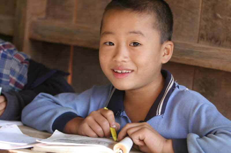 Student in a Rural School in Laos — Young children attend a school in their village, in a remote jungle region of northern Laos — Laos, Children, school, cla...