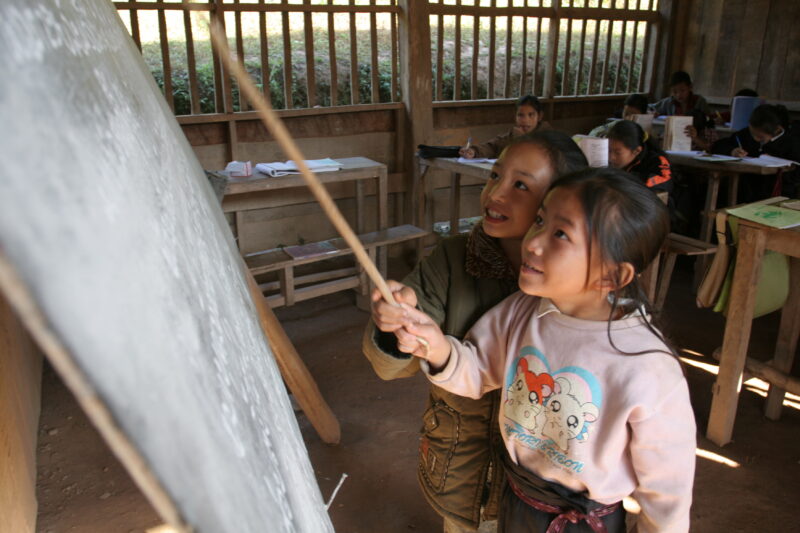 Student in a Rural School in Laos — Young children attend a school in their village, in a remote jungle region of northern Laos — Laos, Children, school, cla...