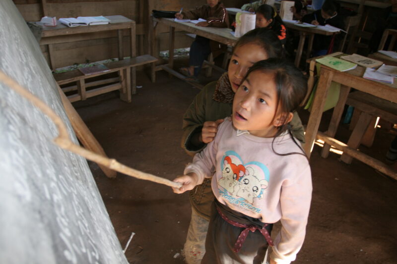 Student in a Rural School in Laos — Young children attend a school in their village, in a remote jungle region of northern Laos — Laos, Children, school, cla...