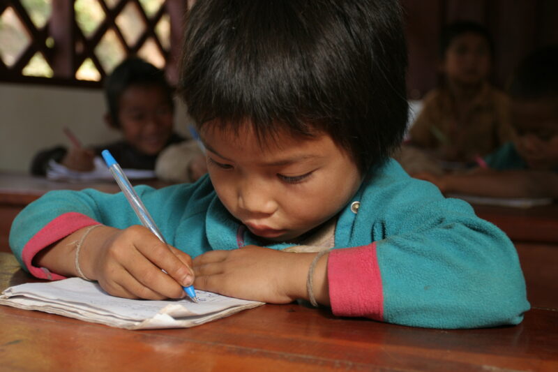 Student in a Rural School in Laos — Young children attend a school in their village, in a remote jungle region of northern Laos — Laos, Children, school, cla...