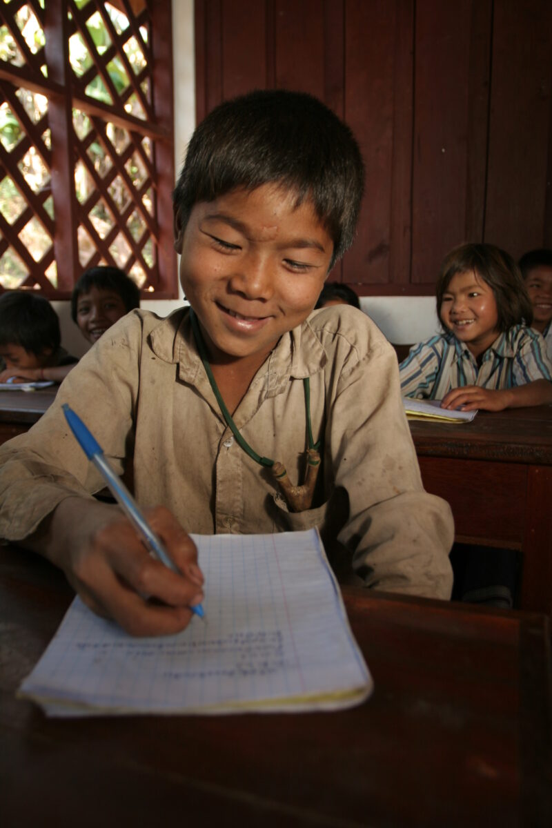 Student in a Rural School in Laos — Young children attend a school in their village, in a remote jungle region of northern Laos — Laos, Children, school, cla...