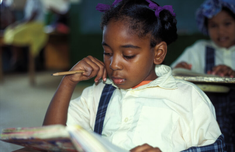 Girl in School in the Dominican Republic — International Childrens's Care in the Dominican Republic runs a christian school for the orphans they host. — Domi...