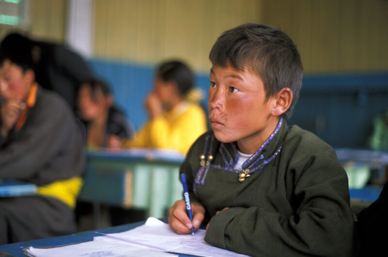 Boy in School in Mongolia — Children of nomadic herders in Mongolia make up for education that they have missed, in a special summer school program conducted...