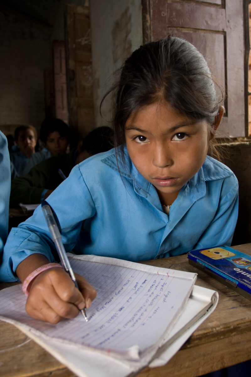 Girl In School in Nepal — Children attend school in rural Nepal, thanks to a sponsorship program run by ADRA — Nepal, students, children, elementary, school