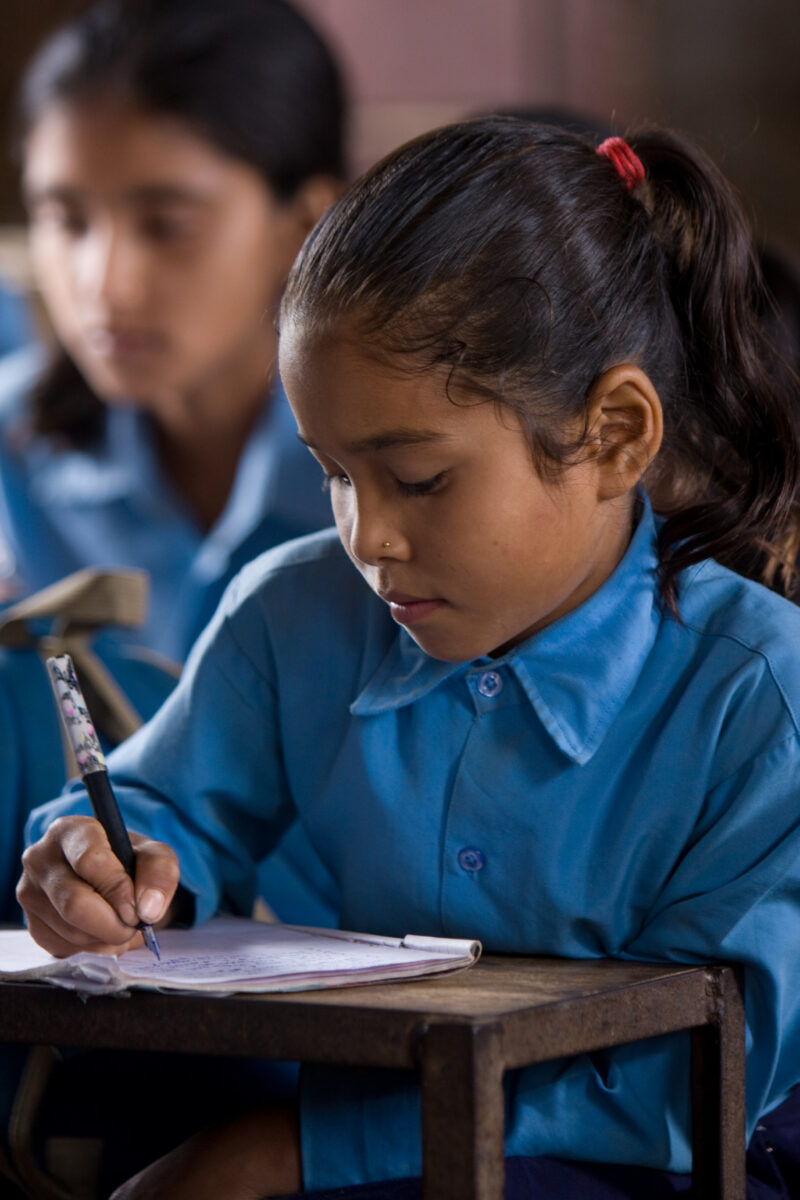 Girl In School in Nepal — Children attend school in rural Nepal, thanks to a sponsorship program run by ADRA — Nepal, students, children, elementary, school