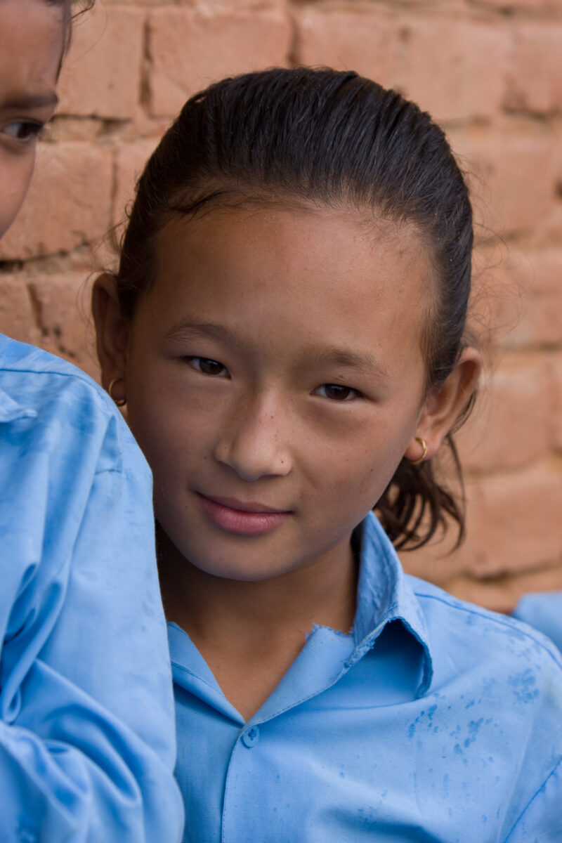 Girl in School in Nepal — Children attend school in rural Nepal, thanks to a sponsorship program run by ADRA — Nepal, students, children, elementary, school
