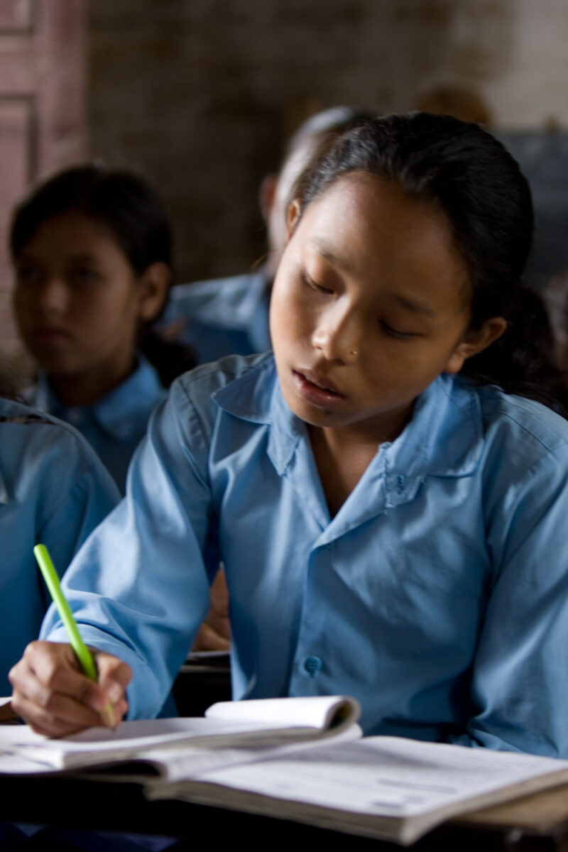 Girl in School in Nepal — Children attend school in rural Nepal, thanks to a sponsorship program run by ADRA — Nepal, students, children, elementary, school