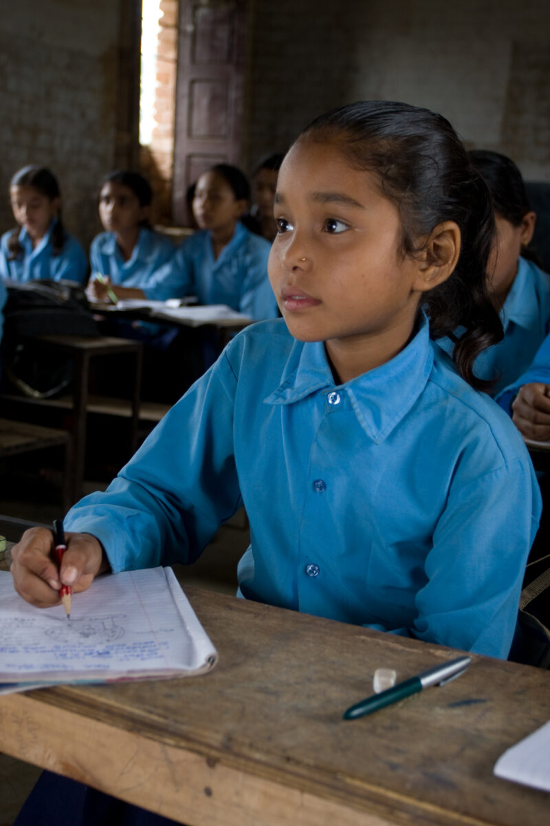 Girl in School in Nepal — Children attend school in rural Nepal, thanks to a sponsorship program run by ADRA — Nepal, students, children, elementary, school