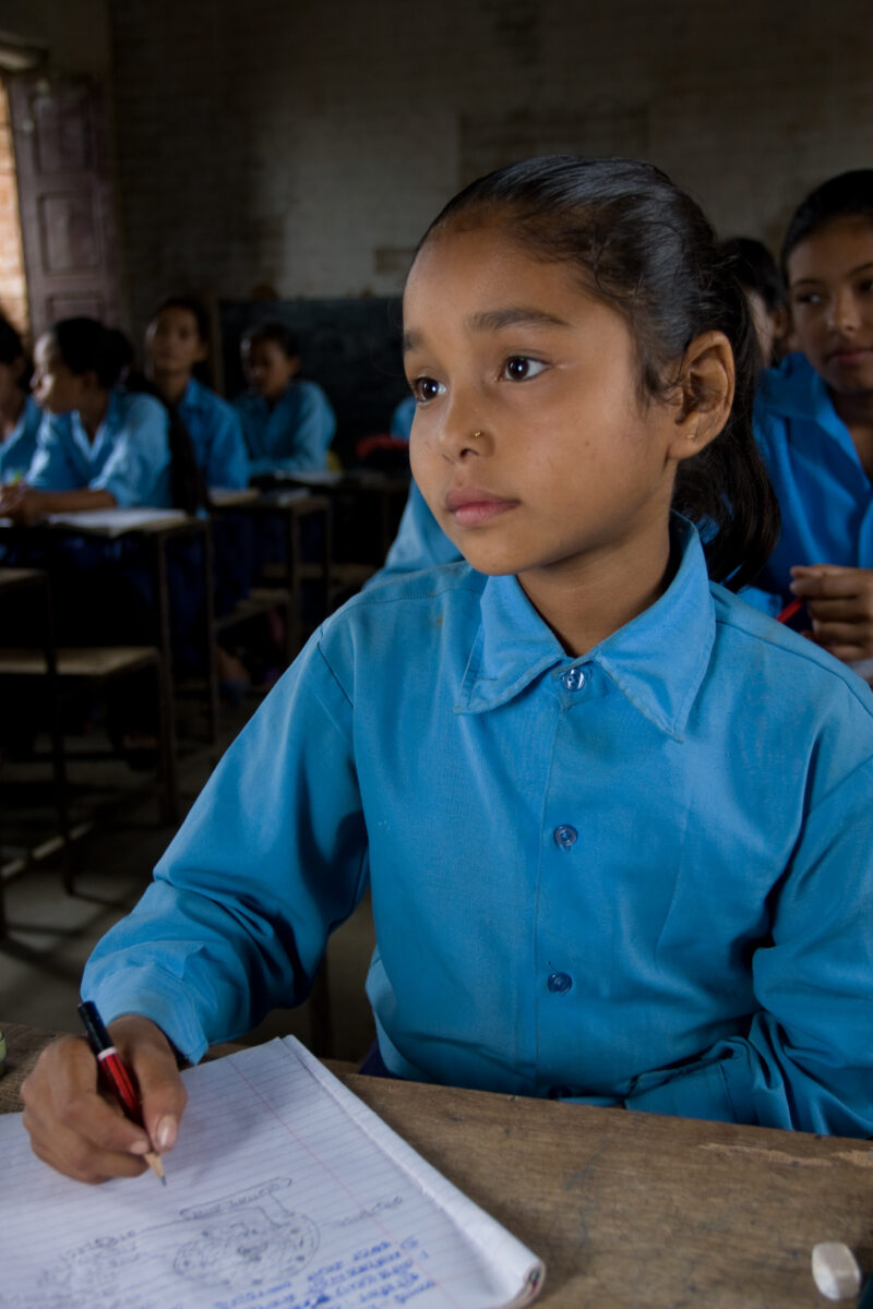 Girl in School in Nepal — Children attend school in rural Nepal, thanks to a sponsorship program run by ADRA — Nepal, students, children, elementary, school