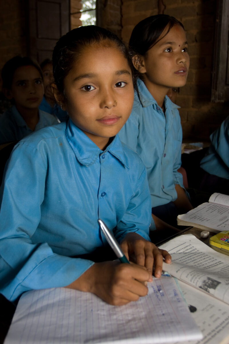 Girl in School in Nepal — Children attend school in rural Nepal, thanks to a sponsorship program run by ADRA — Nepal, students, children, elementary, school