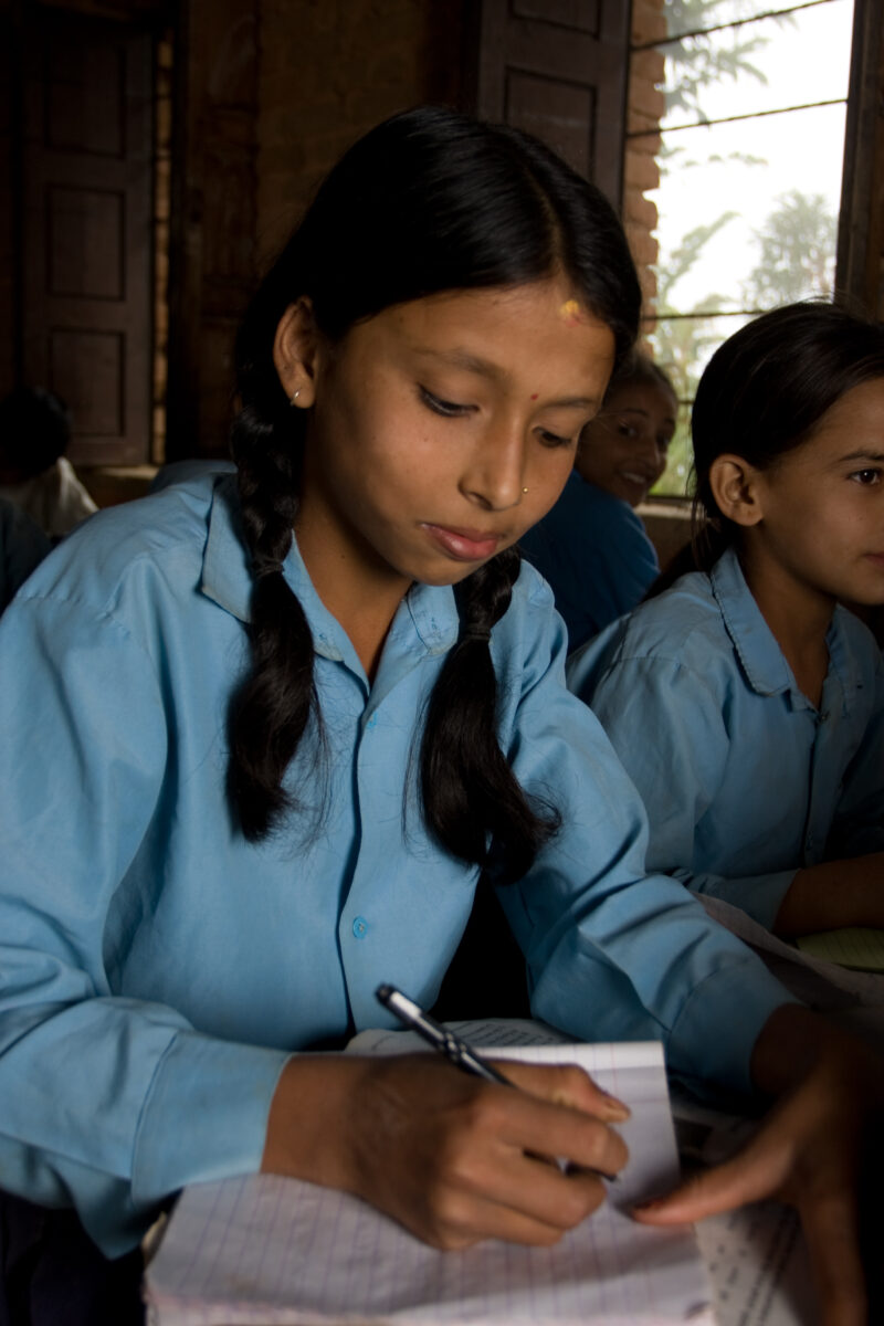 Girl in School in Nepal — Children attend school in rural Nepal, thanks to a sponsorship program run by ADRA — Nepal, students, children, elementary, school