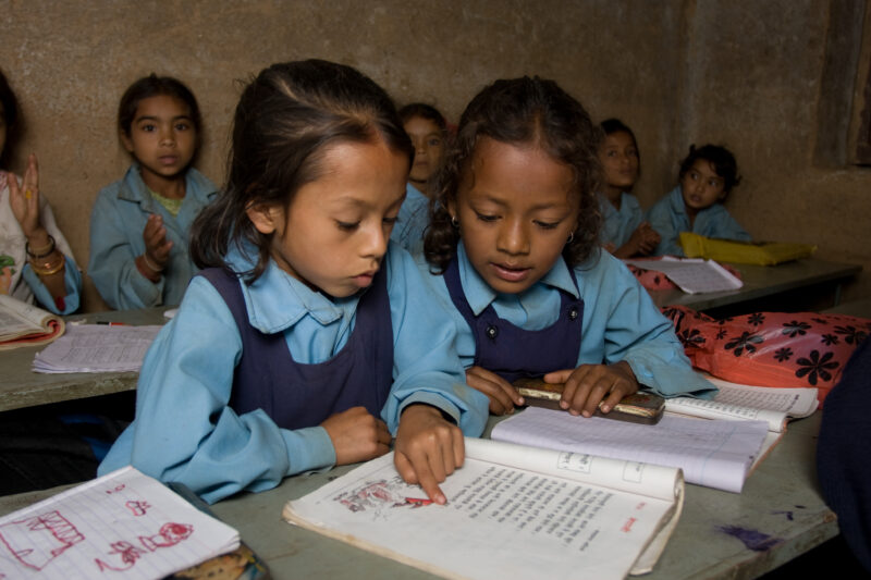 Girls in School in Nepal — Children attend school in rural Nepal, thanks to a sponsorship program run by ADRA — Nepal, students, children, elementary, school