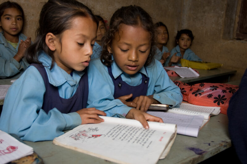Girls in School in Nepal — Children attend school in rural Nepal, thanks to a sponsorship program run by ADRA — Nepal, students, children, elementary, school