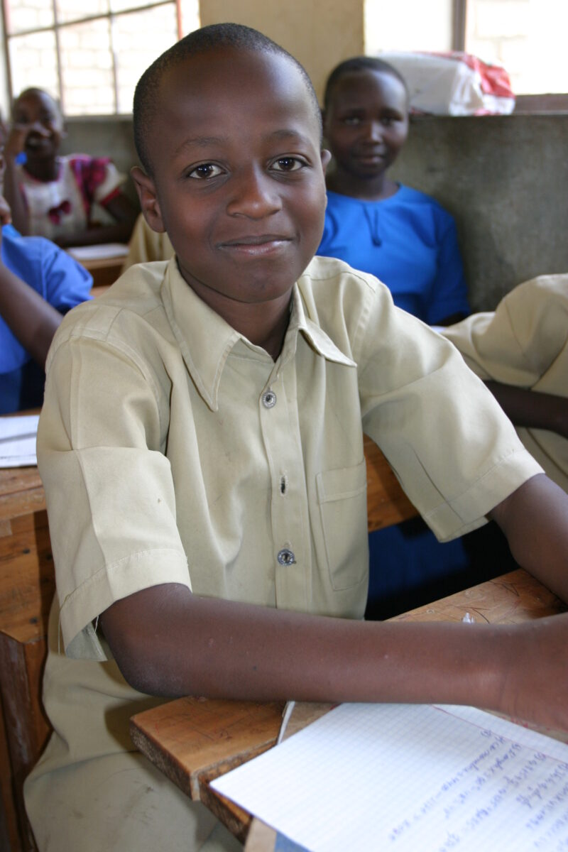 Boy in School in Rwanda — Students of refugees, returning to Rwanda after the genocide, attend schools built in a development program sponsored by ADRA and t...