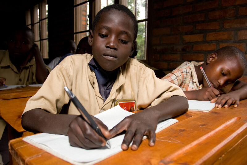 Boy in School in rwanda — Students of refugees, returning to Rwanda after the genocide, attend schools built in a development program sponsored by ADRA and t...