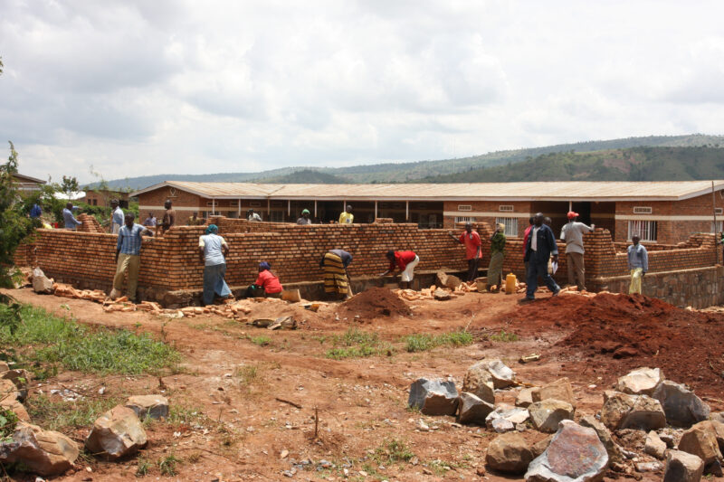 Building Classrooms in Rwanda — Villagers come out to help build more classrooms for their ADRA supported School in A CIDA development program — Africa, Rwan...
