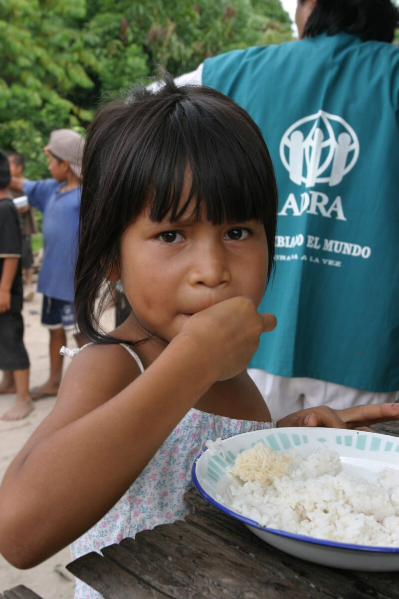 Eating Meal in Peru — Shipibo children eat food they have received from an ADRA distribution. — Peru, ADRA, Poverty, Development