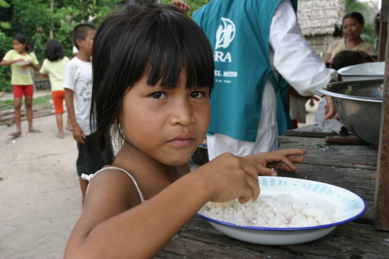 Eating Meal in Peru — Shipibo children eat food they have received from an ADRA distribution. — Peru, ADRA, Poverty, Development