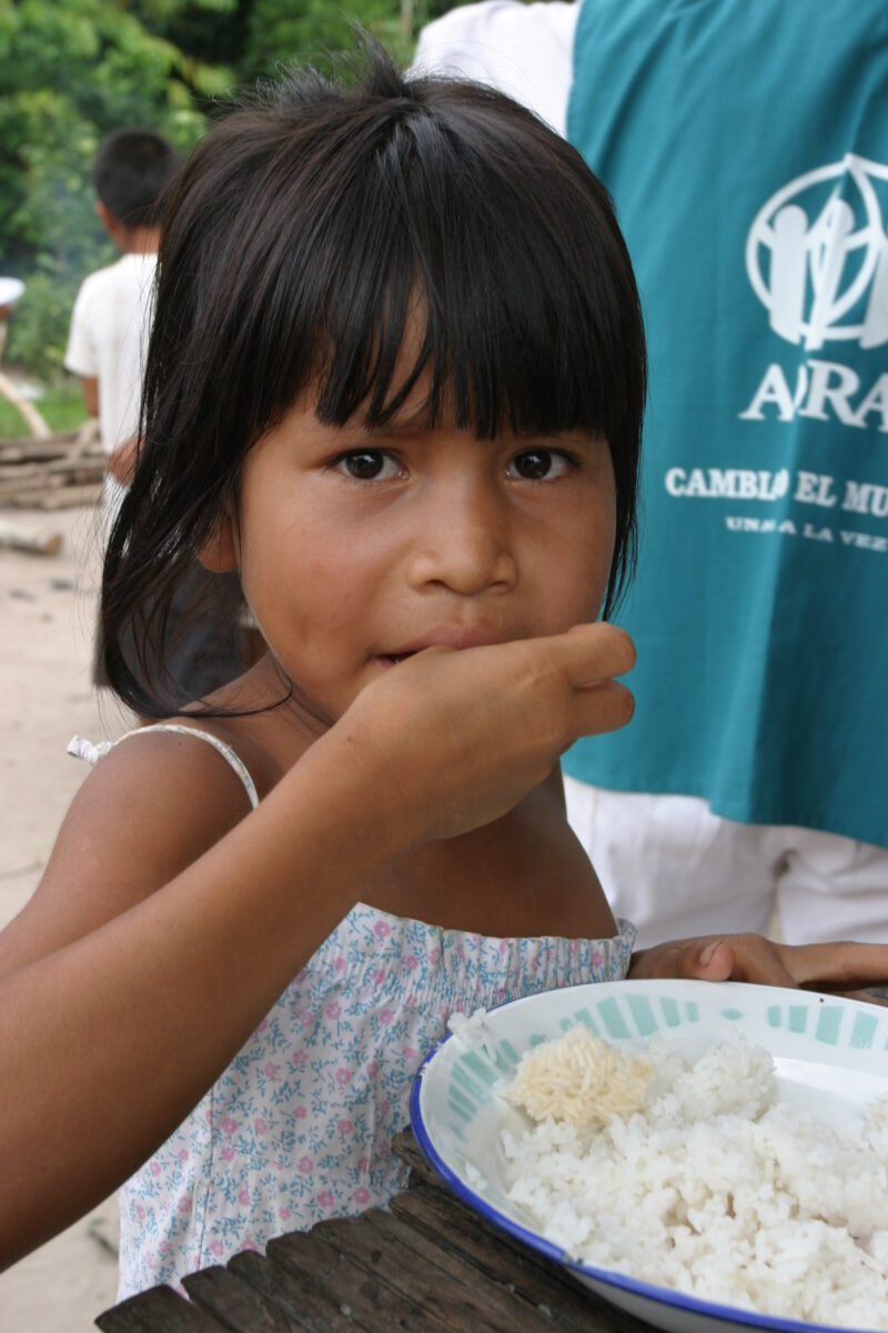 Eating Meal in Peru — Shipibo children eat food they have received from an ADRA distribution. — Peru, ADRA, Poverty, Development