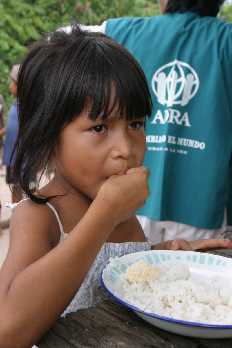 Eating Meal in Peru — Shipibo children eat food they have received from an ADRA distribution. — Peru, ADRA, Poverty, Development