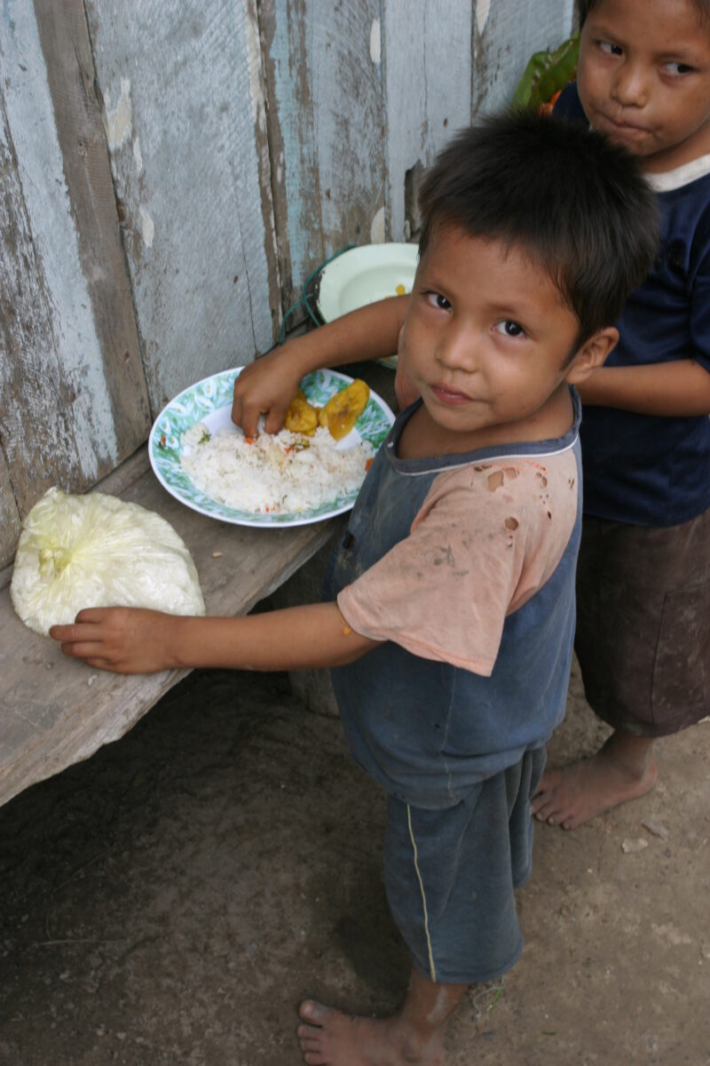 Eating Meal in Peru — Shipibo children eat food they have received from an ADRA distribution. — Peru, ADRA, Poverty, Development