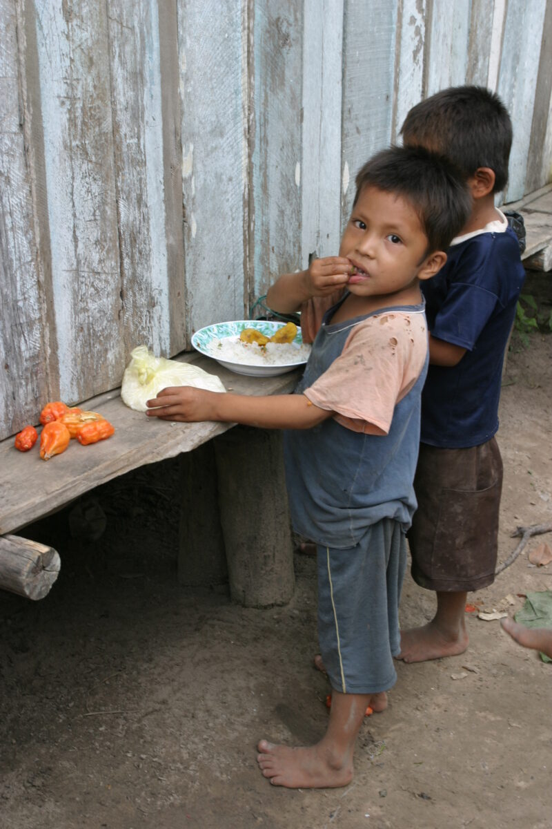 Eating Meal in Peru — Shipibo children eat food they have received from an ADRA distribution. — Peru, ADRA, Poverty, Development
