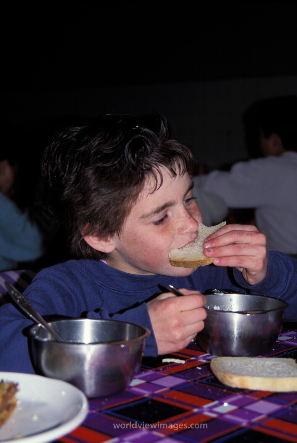 Orphans in Bosnia Eat Food provided by Canadian farmers.