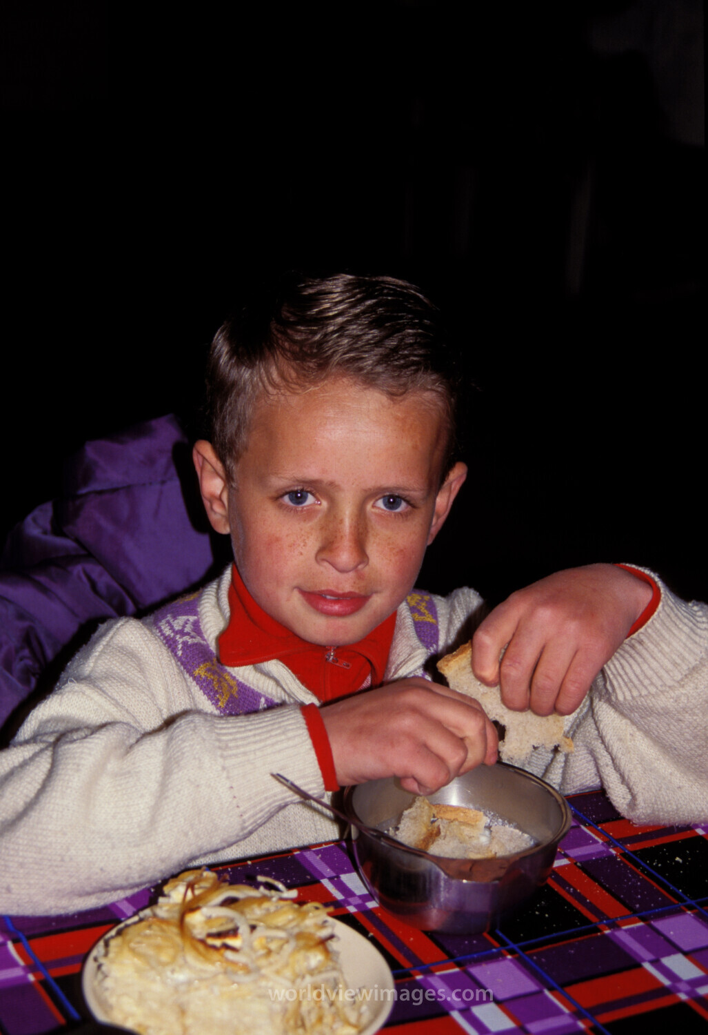 Orphans in Bosnia Eat Food provided by Canadian farmers.