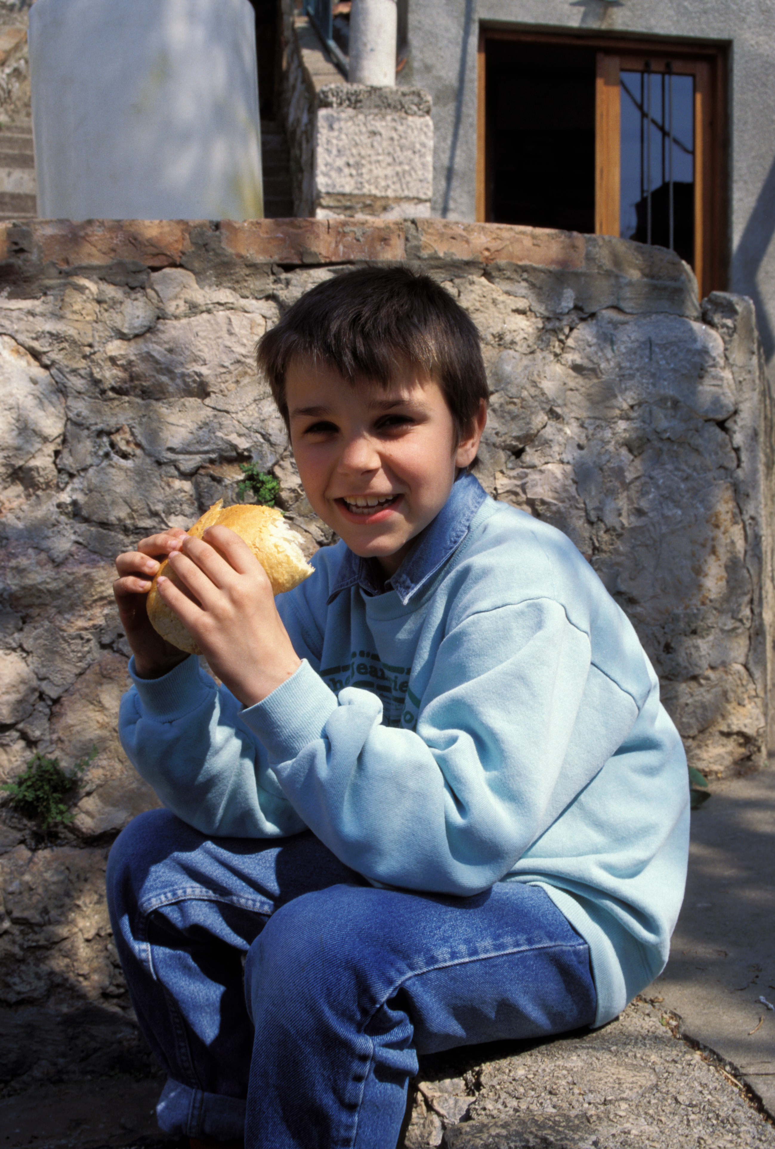 Orphans in Bosnia Eat Food provided by Canadian farmers.