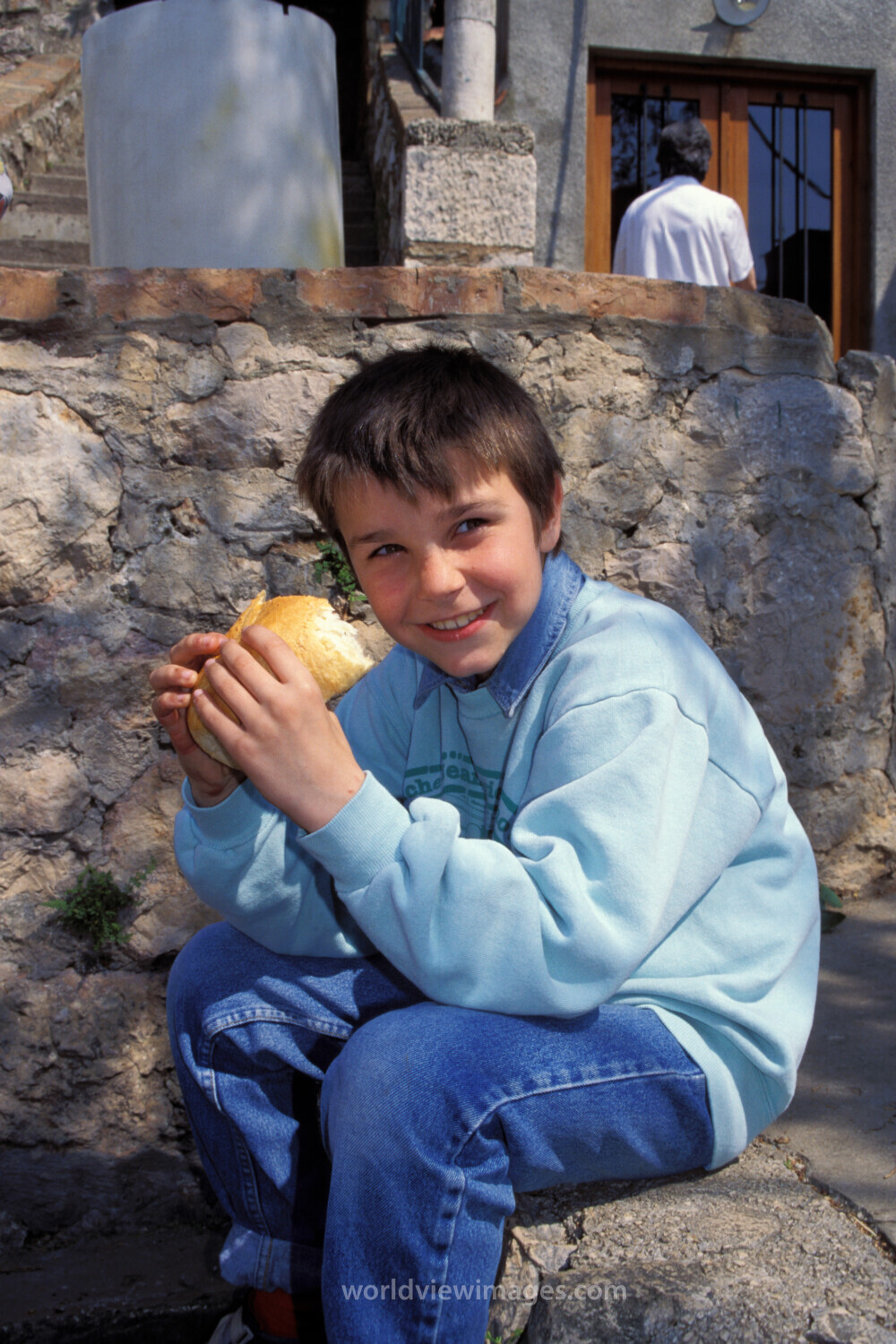 Orphans in Bosnia Eat Food provided by Canadian farmers.