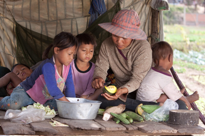 Preparing Meal in Cambodia — Single mother prepares food in a shelter in Cambodia — Cambodia, food, food security, cooking, family