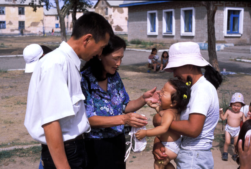 Doctor Checks Baby in Mongolia — Baby in orphanage gets checked by doctor working for ADRA — Mongolia, ADRA, Health, Doctor, Baby