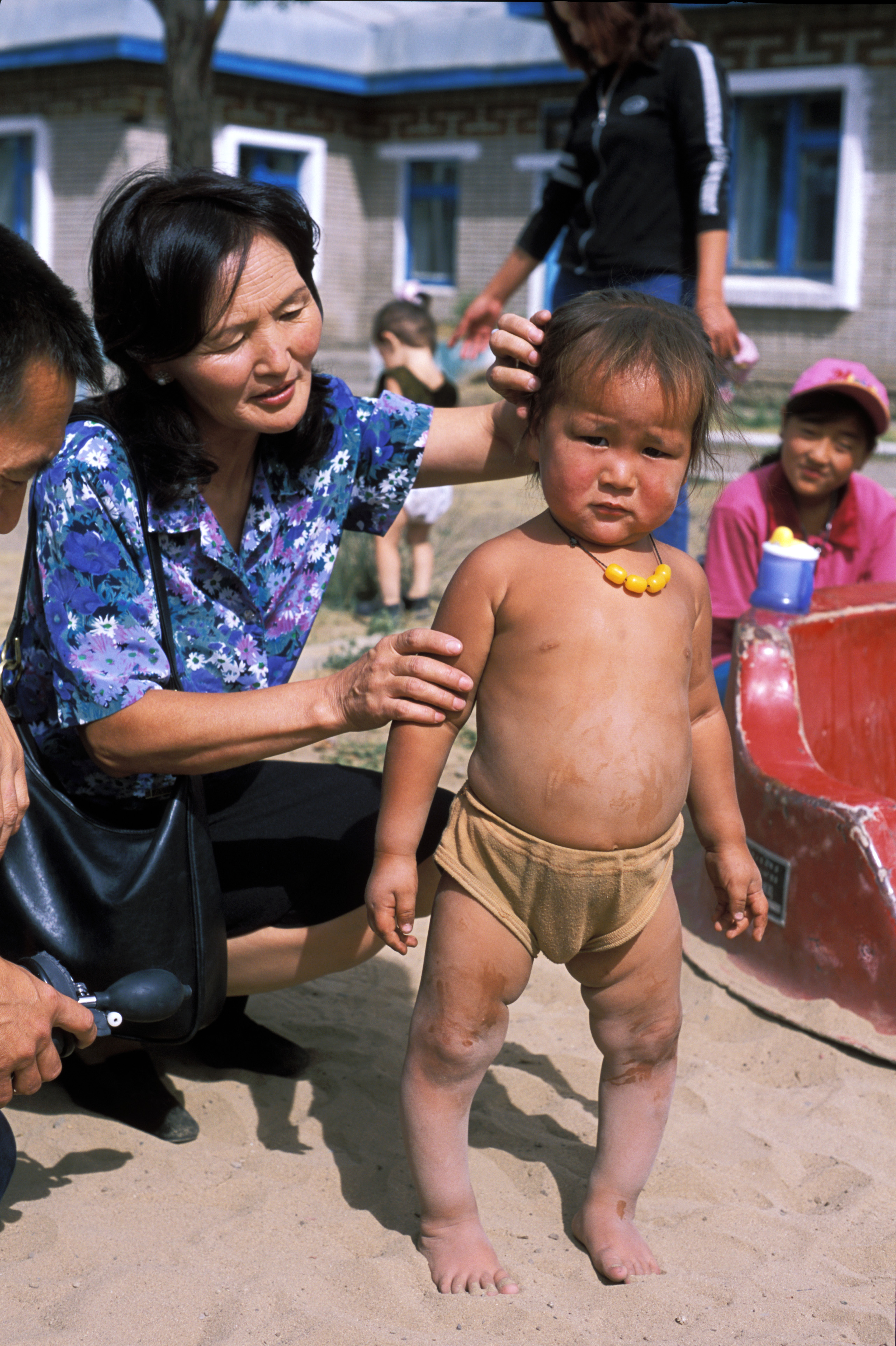 Doctor Checks Baby in Mongolia