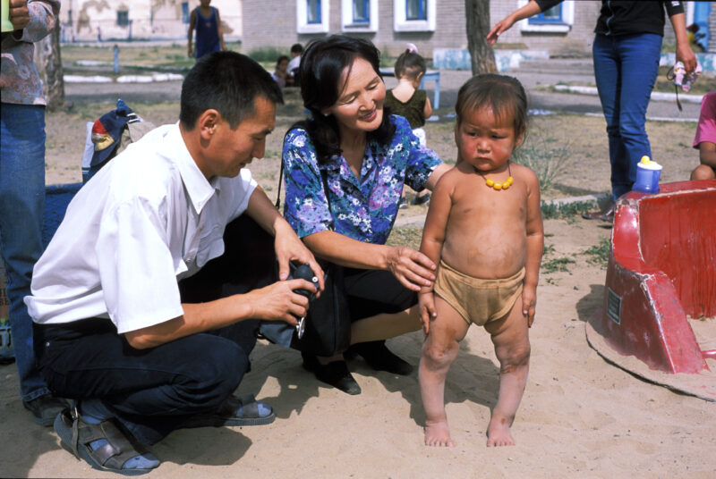 Doctor Checks Baby in Mongolia — Baby in orphanage gets checked by doctor working for ADRA — Mongolia, ADRA, Health, Doctor, Baby