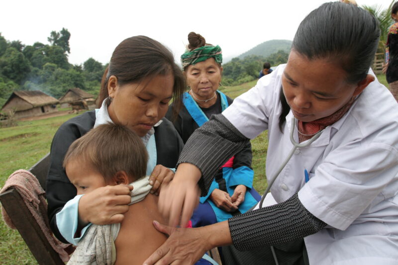 Doctor Visits Village in Laos — Doctor working for ADRA visits people in a remote, ethnic minority village in Laos — Laos, Doctor, health, checkup