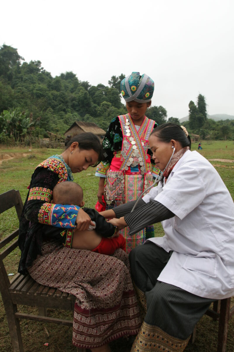 Doctor Visits Village in Laos — Doctor working for ADRA visits people in a remote, ethnic minority village in Laos — Laos, Doctor, health, checkup