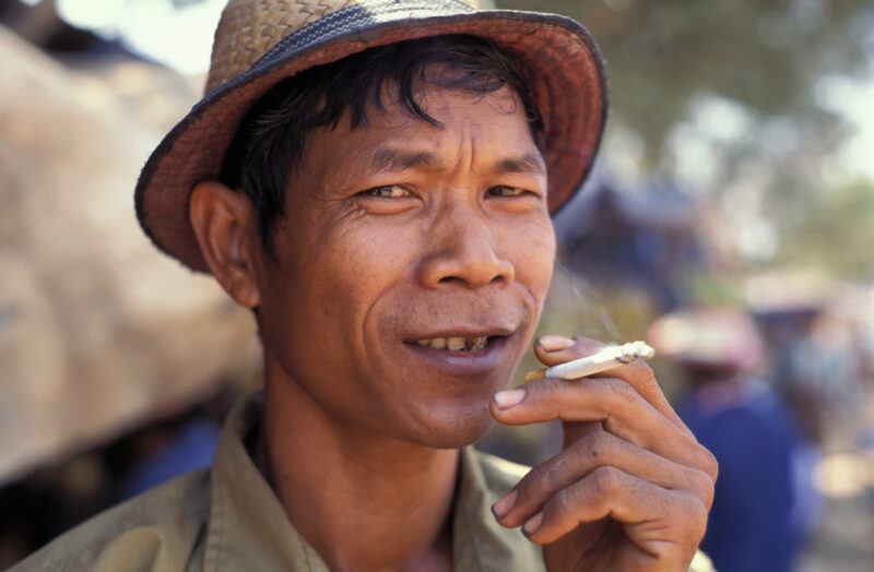 Smoking Man in Cambodia — Stock Image of man smoking cigarette in Cambodia — smoking, cigarette, health, Cambodia, tobacco